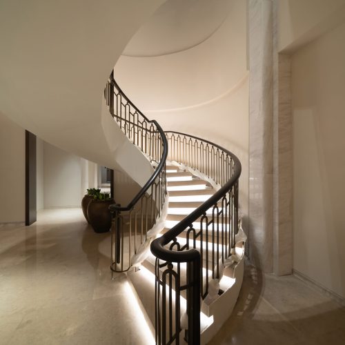 Luxury spiral staircase in lobby hotel with candle lights. Lighting architecture interior design decoration